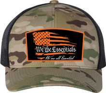 Load image into Gallery viewer, &quot;We The Essentials&quot; Multicam Green and Black Trucker Hat with Orange Patch
