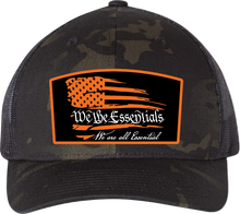 Load image into Gallery viewer, &quot;We The Essentials&quot; Multicam Black Trucker Hat with Orange Patch

