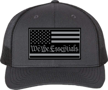 Load image into Gallery viewer, &quot;We The Essentials&quot; Grey and Black Trucker Hat with Grey Patch
