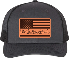 Load image into Gallery viewer, &quot;We The Essentials&quot; Grey and Black Trucker Hat with Leather Patch
